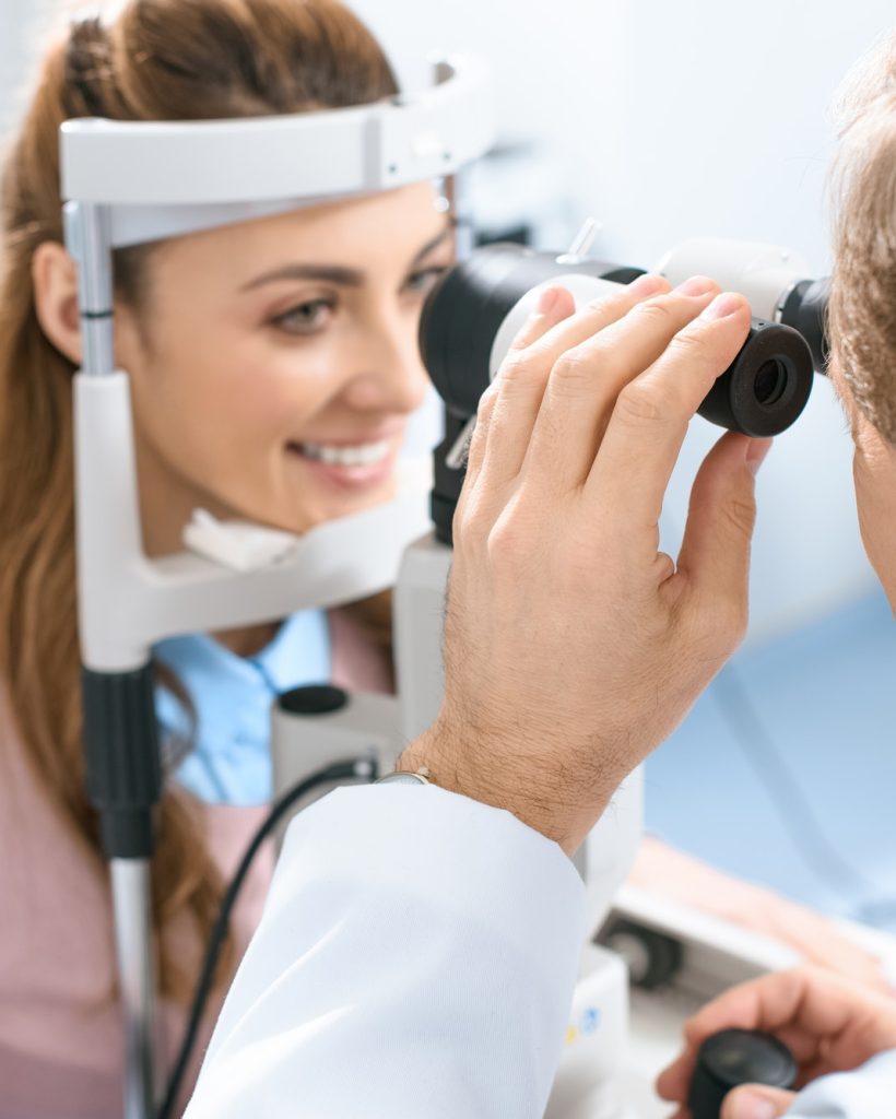 oculist-examining-patient-vision-with-slit-lamp-in-clinic.jpg